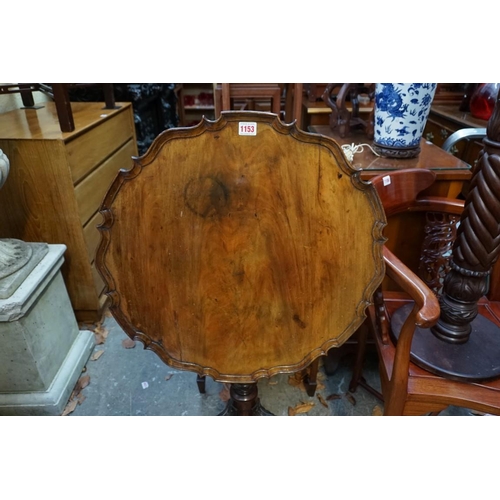 1153 - A late Victorian carved walnut piecrust tilt top tripod table, 59.5cm wide. ... 