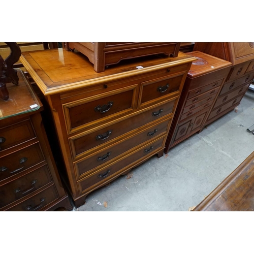 1154 - A reproduction yew wood chest of drawers, with brushing slide, 89cm wide.  ... 