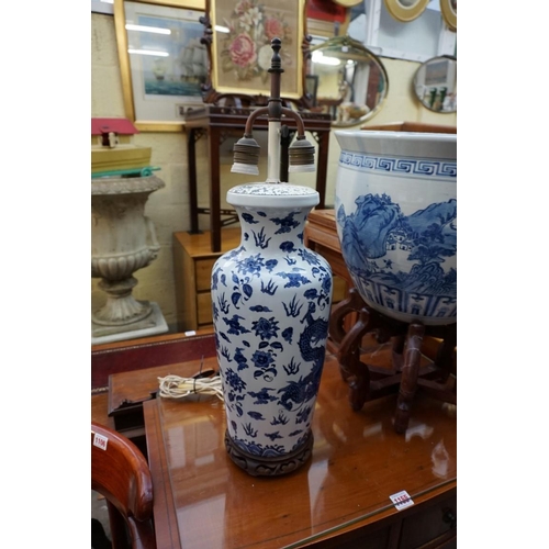 1156 - A Chinese blue and white fish bowl, 38cm diameter, on folding wood stand; together with another... 