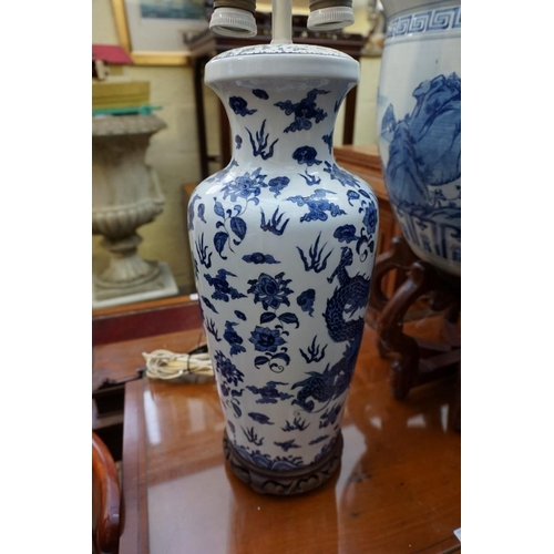 1156 - A Chinese blue and white fish bowl, 38cm diameter, on folding wood stand; together with another... 