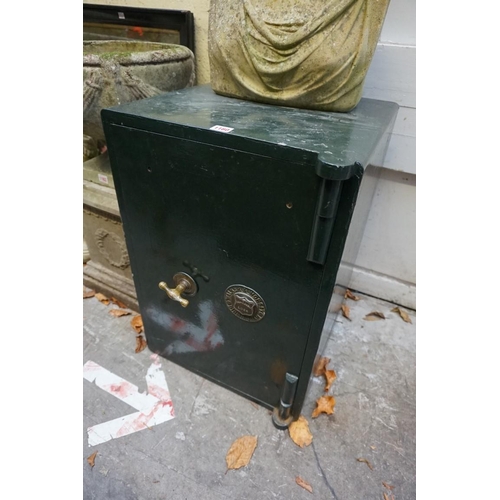 1160 - An old green painted safe by Walker & Worsey, 66cm high x 45.5cm wide x 48cm deep, with two keys... 