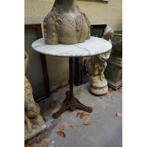 1166 - A marble and cast iron circular pub type table, 60cm diameter. 