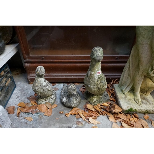 1168 - Three old weathered composition stone ducks, largest 42cm high, (damage and repair to two small... 