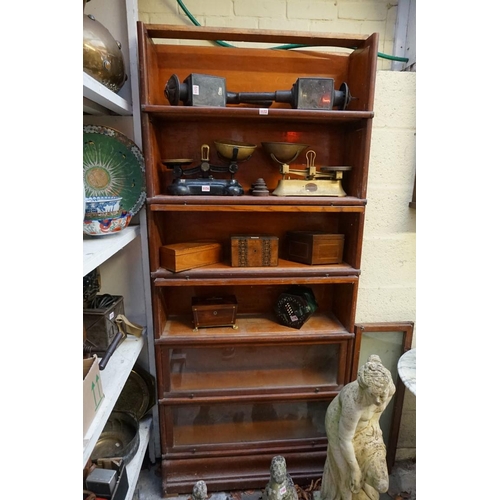 1172 - An early 20th century Globe Wernicke oak six tier sectional bookcase, 87cm wide, (lacking cornice, f... 