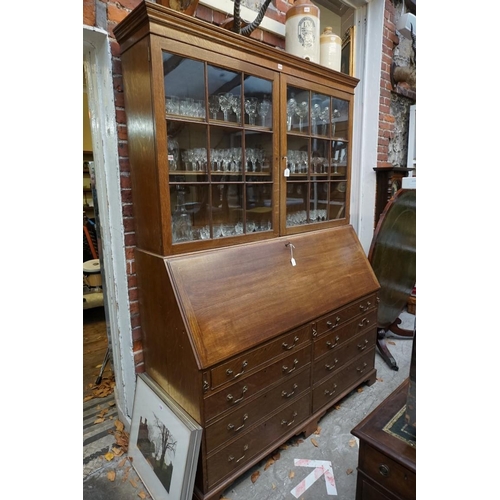 1179 - An unusually large early 20th century oak bureau bookcase, 155.5cm wide.