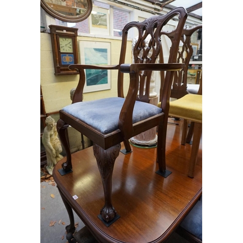 1183 - An early 20th century mahogany extending dining table and a set of six similar chairs, to include a ... 