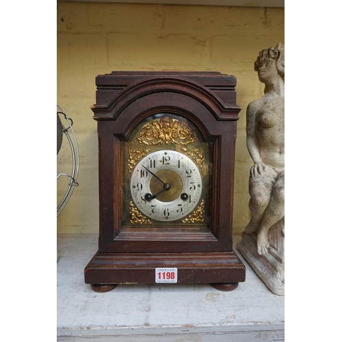 1198 - An early 20th century mahogany mantel clock, 32.5cm high. 