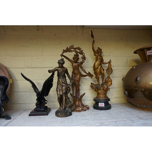 1203 - Three Spelter figures, largest 60cm; together with a resin eagle. (4)