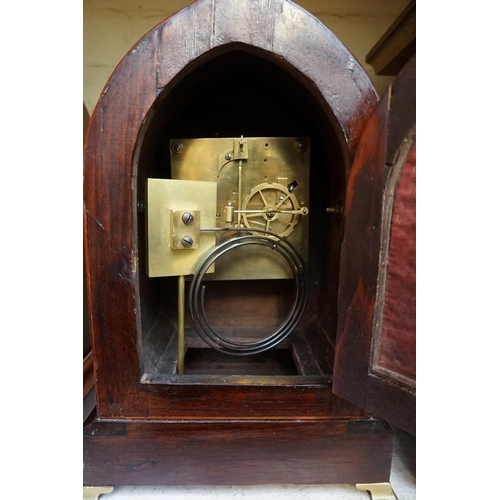 1209 - An antique rosewood and inlaid lancet form mantel clock, 32.5cm high, with pendulum. ... 