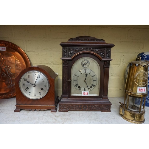 1212 - An early 20th century carved mahogany mantel clock, 35cm high; together with another vintage mantel ... 