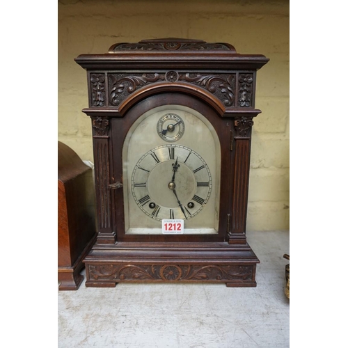 1212 - An early 20th century carved mahogany mantel clock, 35cm high; together with another vintage mantel ... 