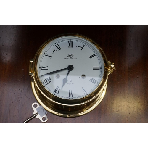 1217 - A Schatz 'Royal Mariner' brass bulkhead clock, 18cm diameter; together with another wall timepiece, ... 