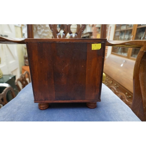 1220 - A miniature hardwood chest of drawers, 22.5cm wide.  