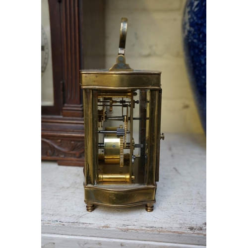 1223 - A vintage gilt brass easel timepiece, 12cm wide, (one hand detached); together with an old brass car... 