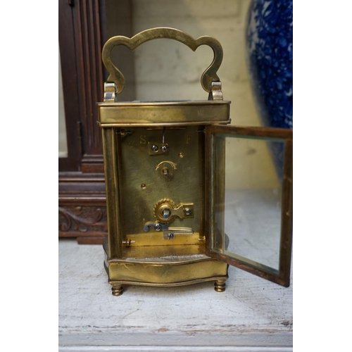 1223 - A vintage gilt brass easel timepiece, 12cm wide, (one hand detached); together with an old brass car... 