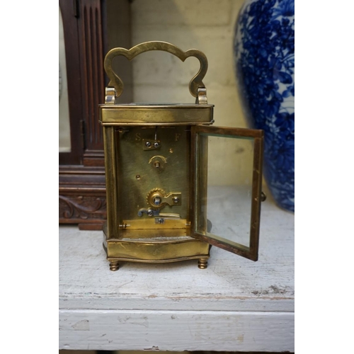 1223 - A vintage gilt brass easel timepiece, 12cm wide, (one hand detached); together with an old brass car... 