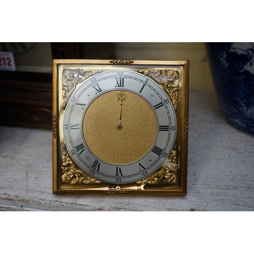 1223 - A vintage gilt brass easel timepiece, 12cm wide, (one hand detached); together with an old brass car... 