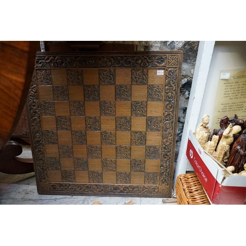 1226 - A resin 'Westminster Abbey' chess set, king 20cm, pawn 8.5cm; together with a similar chess board, 6... 