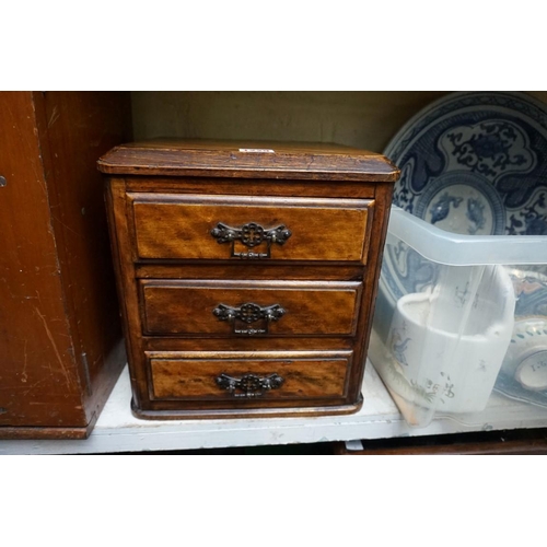 1229 - A small old mahogany chest, 27cm wide, (formerly part of a larger item).