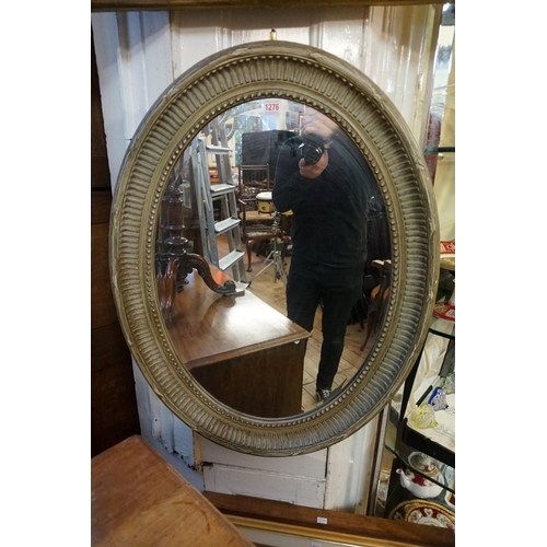 1276 - A painted frame oval wall mirror, 86 x 66cm.  