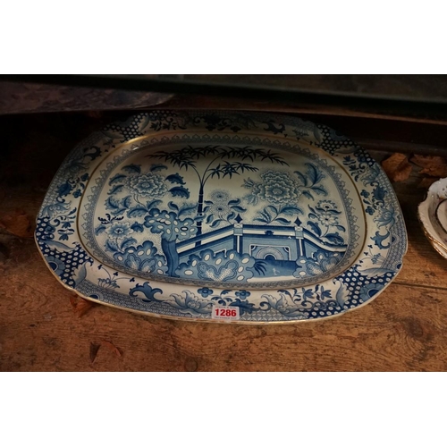 1286 - A collection of 19th century blue and white meat plates, to include a Davenport 'Well' example, 52cm... 