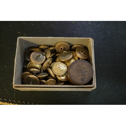 1328 - A collection of brass military buttons and badges; together with a silver ARP badge; and other relat... 