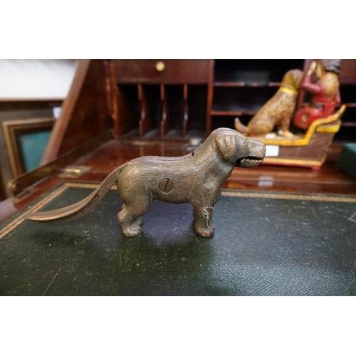 1330 - A painted cast iron 'Speaking Dog Bank'; together with a dog nutcracker; a novelty can opener; and o... 