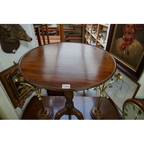 1345 - An antique mahogany circular tilt top tripod table, 58cm wide.