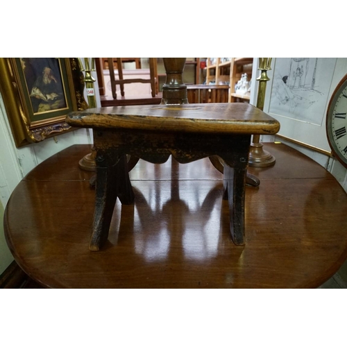 1347 - An antique elm milking stool, 34cm wide. 