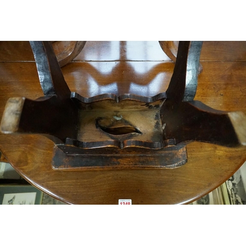 1347 - An antique elm milking stool, 34cm wide. 