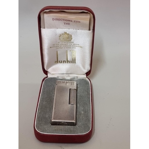 1651 - A cased vintage Dunhill 'Rollagas' engine turned silver plated lighter, with instructions, ... 