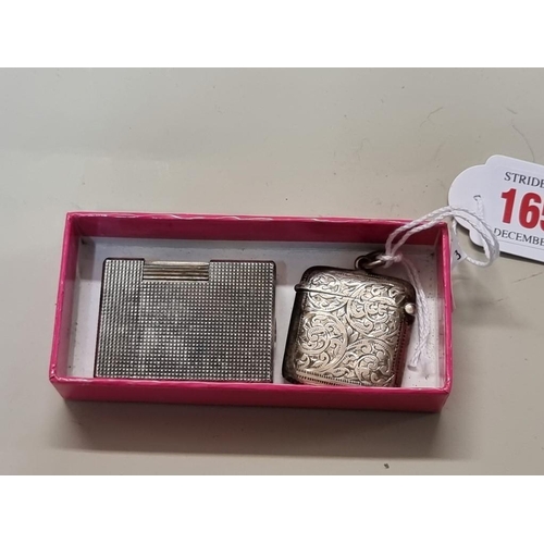 1652 - A silver vesta case; together with a vintage Dupont engine turned silver plated lighter, 4.6cm high.... 