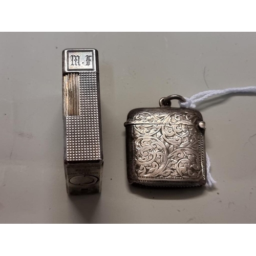 1652 - A silver vesta case; together with a vintage Dupont engine turned silver plated lighter, 4.6cm high.... 