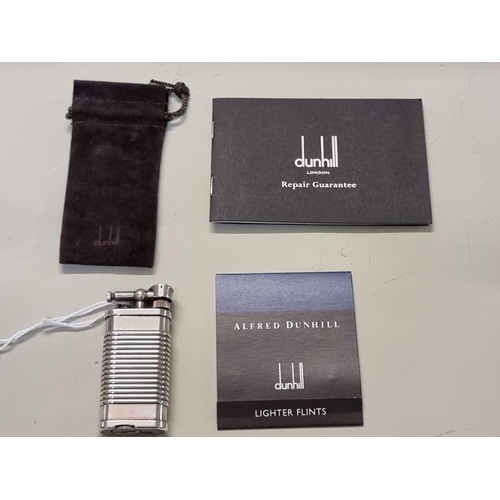 1668 - A Dunhill 'Unique' silver plated lighter, model UL 1324, with velvet drawstring bag, and repair guar... 