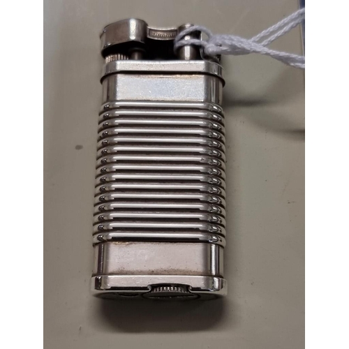 1668 - A Dunhill 'Unique' silver plated lighter, model UL 1324, with velvet drawstring bag, and repair guar... 