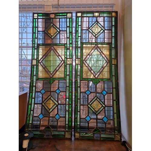 1674 - A pair of stained and leaded glass rectangular panels, each initialled 'H.S.' and dated 2000, 1... 