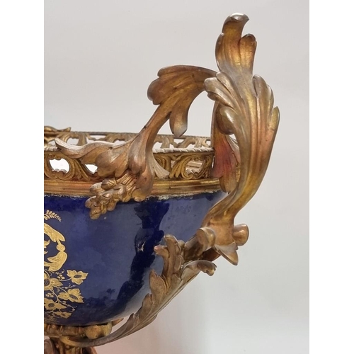 1679 - A large and impressive 19th century Sevres style and gilt bronze mounted twin handled centrepiece, p... 