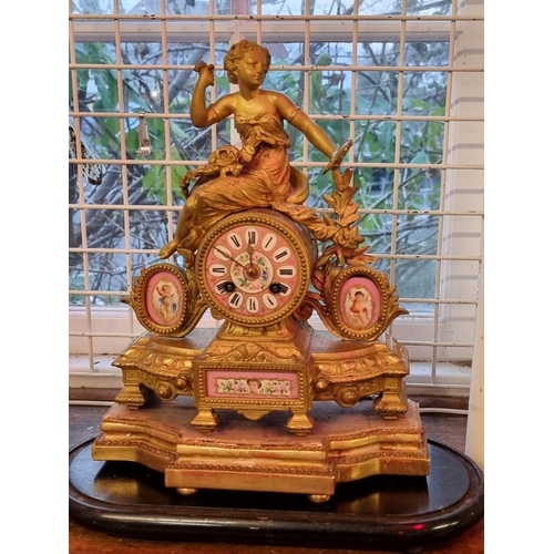 1681 - A late 19th century gilt brass and pink porcelain mantel clock, 32cm high, with pendulum, on gi... 