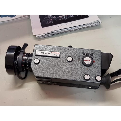 1684 - Cameras: a Leicina Super RT1 8mm film camera, with instructions and original case; together with a f... 