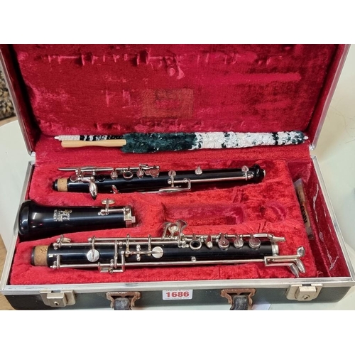 1686 - Two old clarinets, to include a Boosey & Hawkes example, each in case. 