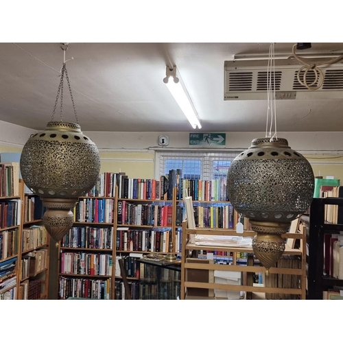 1687 - A large pair of Moorish style pierced brass hanging lanterns, 56cm high. 