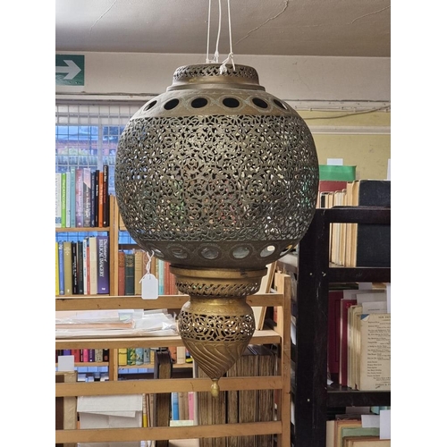 1687 - A large pair of Moorish style pierced brass hanging lanterns, 56cm high. 