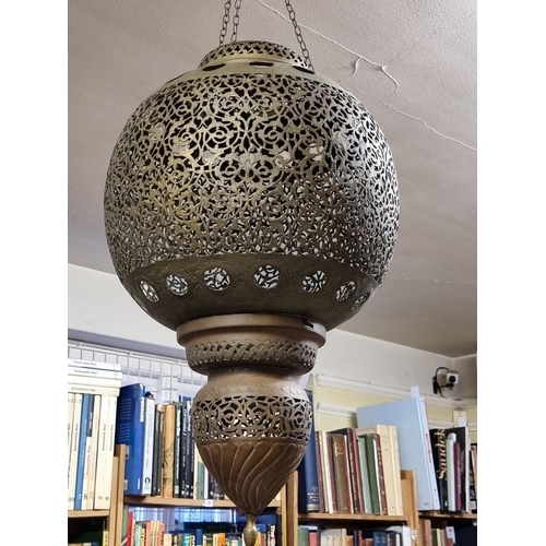 1687 - A large pair of Moorish style pierced brass hanging lanterns, 56cm high. 