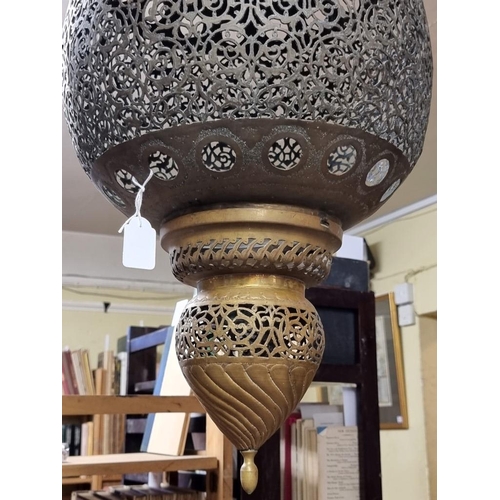 1687 - A large pair of Moorish style pierced brass hanging lanterns, 56cm high. 