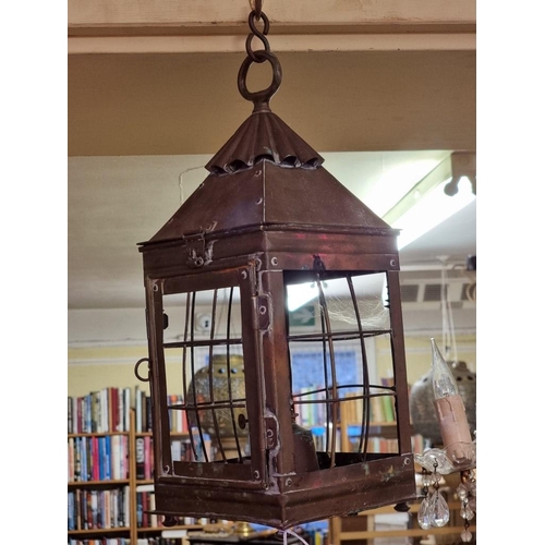 1688 - An old brass hanging lantern, 42cm high. 