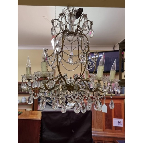 1689 - An old gilt metal and facetted bead drop six branch chandelier, 57cm high.