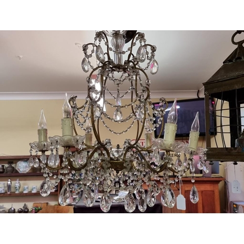 1689 - An old gilt metal and facetted bead drop six branch chandelier, 57cm high.