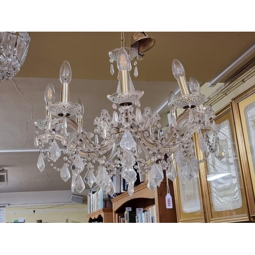 1692 - A facetted glass drop eight branch chandelier, approx 48cm high.