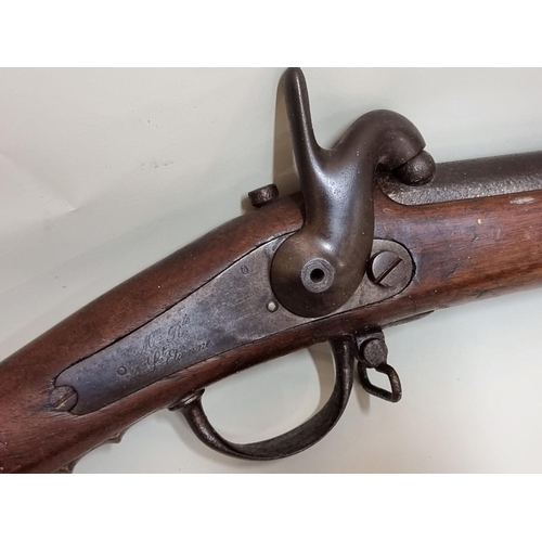 1707 - A mid 19th century French musket, marked St Etienne; together with a similar reproduction example, (... 