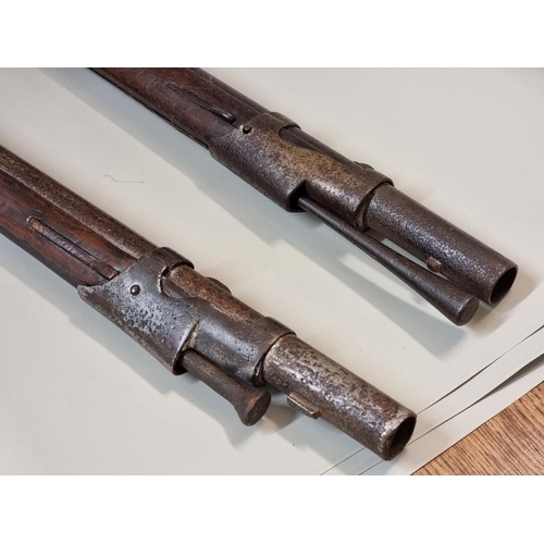 1707 - A mid 19th century French musket, marked St Etienne; together with a similar reproduction example, (... 